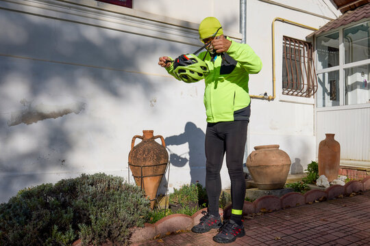 Old man exercising by riding a bicycle on a beautiful autumn day - Powered by Adobe