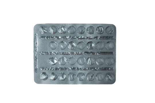 Partially used blister pack of round tablets on transparent background
