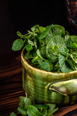 Fresh mint leaves in rustic bowl