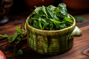 Fresh mint leaves in ceramic bowl