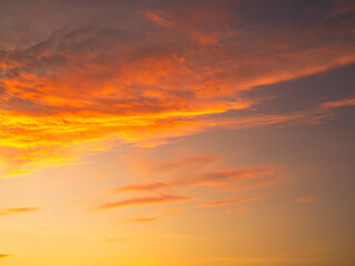 Fototapeta premium Sky sunset evening sunrise cloud weather dramatic landscape goldent and indigo color gradient pastel horizon, twilight yellow golden reflection morning nature environment energy ecosystem change