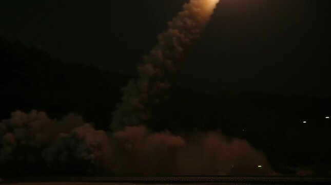 Rocket takeoff from a launch complex. War declared at night