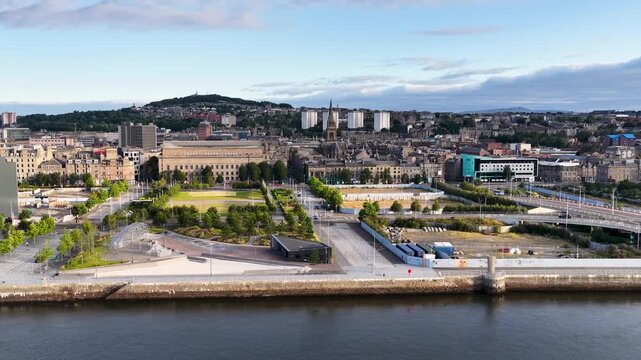 Aerial Pan Over Dundee Waterfront and Urban Cityscape at Dusk