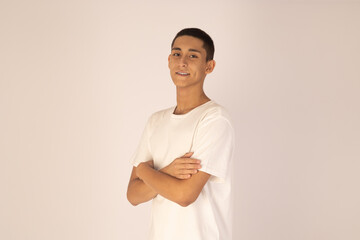 Young man is standing with his arms crossed