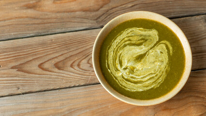 Black radish leaf soup. Rustic wooden background with copy space. 