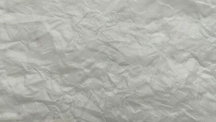Abstract white plastic crumpled wrinkled texture background. Polyethylene foil messy surface pattern.