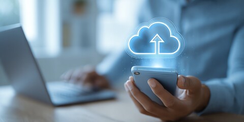 A person using a smartphone while uploading data to the cloud, symbolizing modern digital innovation