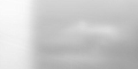 Textured monochromatic background resembling frosted or etched glass with subtle gray gradient. It features bright white light source on the left and central soft light reflection