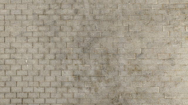 Fototapeta Aerial view of a gray brick pavement. Ideal for textures, patterns and backgrounds.