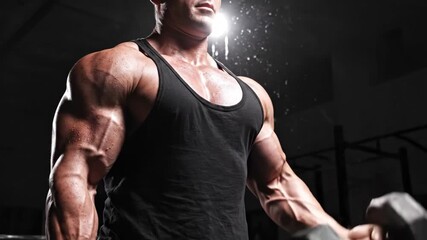 Strong man training, biceps curl with dumbbell. Workout and exercising for muscle gain. Power, strength, sport lifestyle.