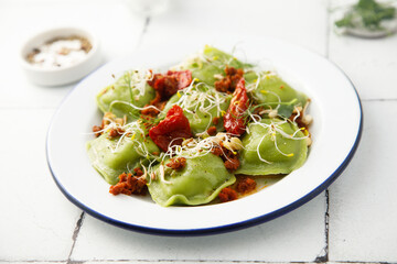 Spinach ravioli with sun dried tomatoes