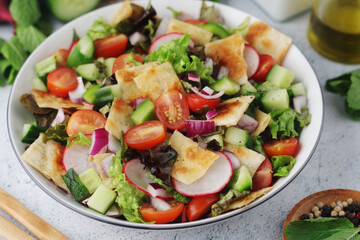 A bowl with Fattoush - Traditional Levantine salad	