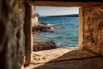 Rugged stone window overlooking tranquil coastal harbor