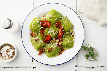Spinach ravioli with sun dried tomatoes