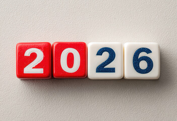 Number tiles display 2026 against a neutral background, symbolizing the upcoming year and new possibilities