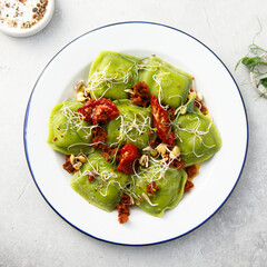 Spinach ravioli with sun dried tomatoes