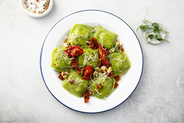 Spinach ravioli with sun dried tomatoes