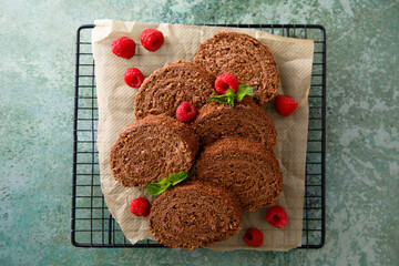 Dark chocolate swiss roll with raspberry