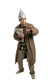 A person looking paranoid wearing a tin foil hat