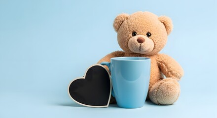 Teddy bear with blue mug and heart shaped chalkboard on blue background stuffed animal