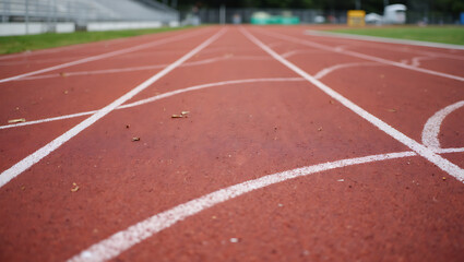 Fototapeta premium Red Running Track with Lanes – Athletic Track Perspective and Sports Background