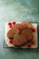 Dark chocolate swiss roll with raspberry