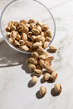 Bowl of pistachios isolated on countertop kitchen surface