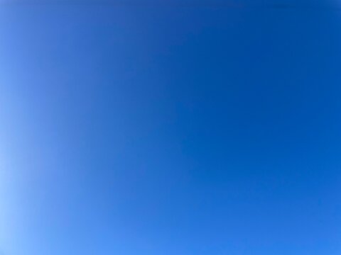 Raw unedited Spanish Iberian clear sky with beautiful light blue gradient. Morning 9am bright sunlight in Autumn. Natural, artistic, artsy and trendy sky blue background template layer. Relaxing, calm