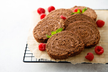 Dark chocolate swiss roll with raspberry
