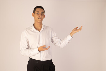 Man is standing and gesturing with both hands.