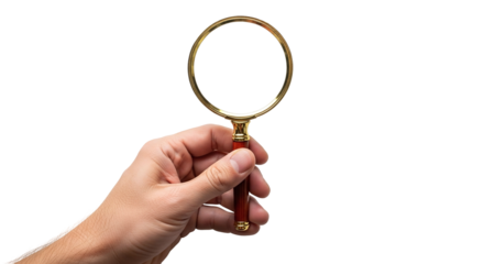 A hand holds a classic magnifying glass with a golden frame and a red wooden handle, symbolizing search, investigation, and discovery, isolated on transparent background