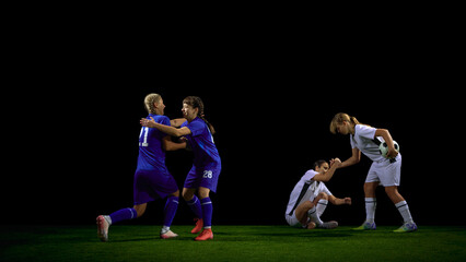 Female soccer players joyfully celebrating win and supporting teammate. Concept of team-spirit promotion, motivational posters, youth club campaigns, positive sport culture.