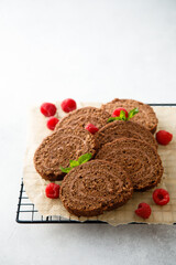 Dark chocolate swiss roll with raspberry