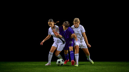 Teenage female soccer players battling tightly for ball in crowded duel. Concept of youth competition training, close-contact drills, tactical discipline, team strategy.