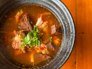 Traditional Thai noodle soup called &ldquo;Nam Ngiao&rdquo; This Northern Thai dish features rice noodles in a spicy and tangy tomato-based broth with pork, dried chili,