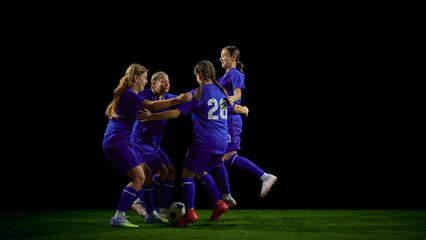 Teenage soccer team celebrating together in energetic group movement. Concept of youth club branding, motivation campaigns, team-spirit communication, sports promotion.