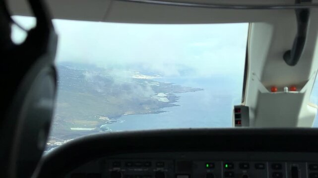 Private Jet Airplane Flying Through Clouds Revealing La Palma Airport - Pilot POV
