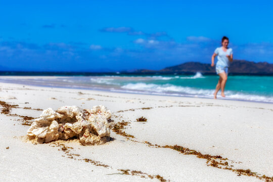 Unrecognisable female enjoying holiday leisure time at sandy beach on Fiji tropical islands.