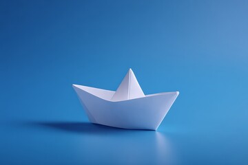 Obraz premium Single white paper boat on a bright blue background