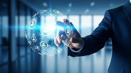 Businessman interacting with a glowing digital sphere of icons