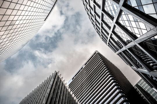 Architecture and skyscraper geometry in Paris where reflection highlights support finance and business ideas across the urban landscape surrounding the well-known corporate district of La Defense.