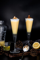 Lemon meringue cocktail with toasted topping in tall flute glasses