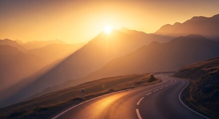 A winding mountain road curves through a majestic landscape during a golden sunrise, with sunbeams breaking through the haze.