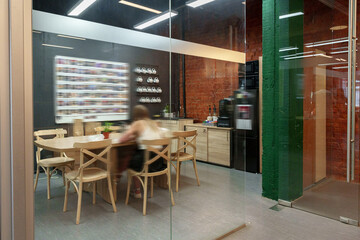 Modern office space featuring collaborative workspace and casual dining area