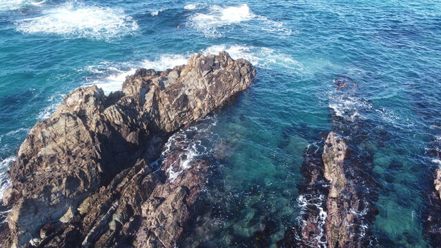 Rugged rocks in the ocean - Powered by Adobe