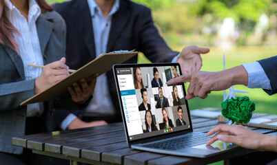 Business people on video conference for brisk virtual group meeting of corprate business office workers