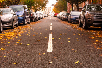 West London street with parked cars and Victorian townhouses, Barons Court West London