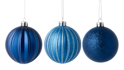 Three festive blue oval christmas ornaments with ribbed and glitter textures hanging against a dark background