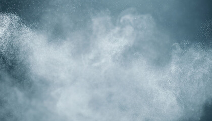 Fototapeta premium Abstract image of white powder or dust cloud against a dark background.