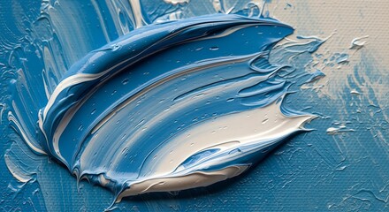 Close-up of vibrant blue and white oil paint strokes on a canvas.
